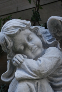 Beautiful sitting angel, full of detail, full of stone.