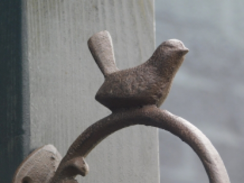 Cast iron hook with bird, brown, very beautiful to behold