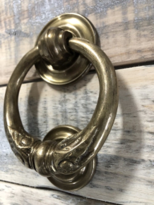 Door knocker, stylish and antique brass.