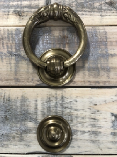 Door knocker, stylish and antique brass.