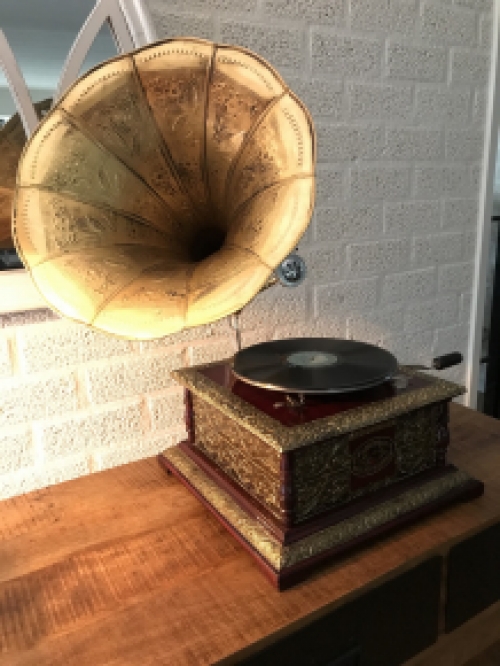 Graceful nostalgic gramophone, record player made of brass and wood