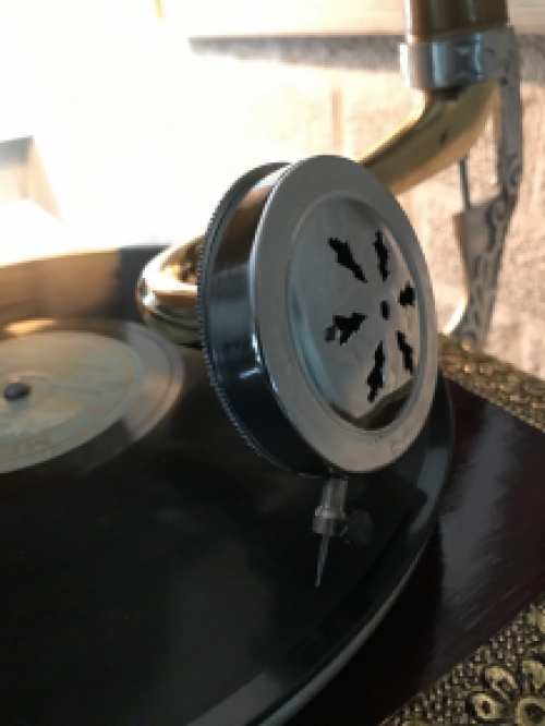 Graceful nostalgic gramophone, record player made of brass and wood