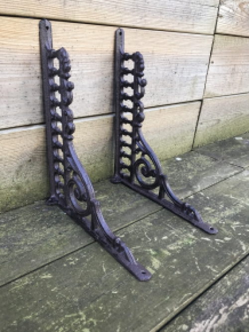 Set of antique sleek shelf supports, cast iron.