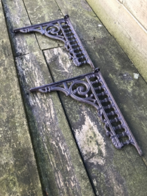 Set of antique sleek shelf supports, cast iron.