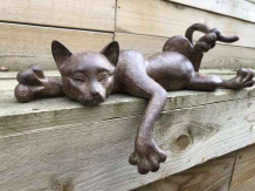 Sculpture lying cat from Polystein