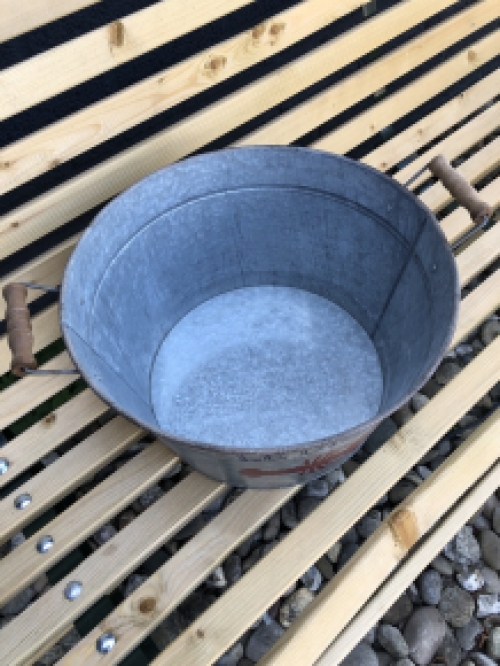 A very decorative, beautiful zinc bowl small with the text 