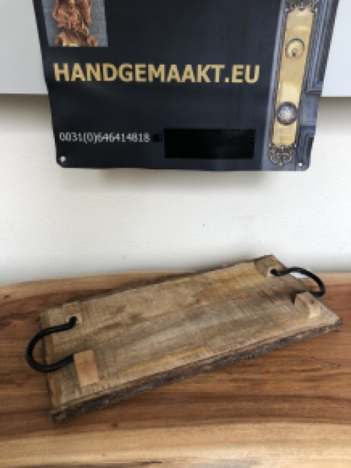 Beautiful rustic cutting board made of solid wood, nostalgic kitchen board, with metal brackets.