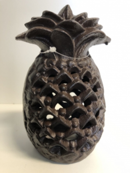 Cast iron lantern in the shape of a pineapple, atmospheric lighting.