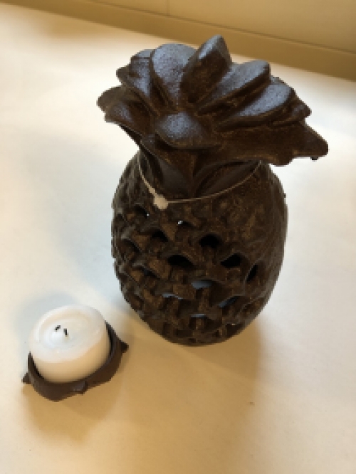 Cast iron lantern in the shape of a pineapple, atmospheric lighting.