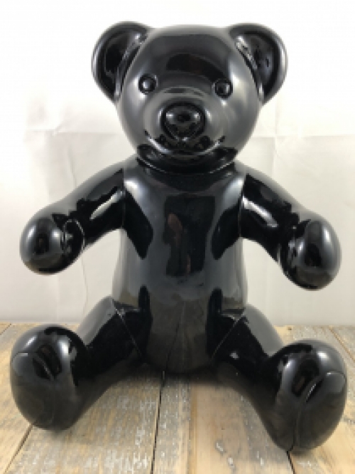 Beautiful black sitting polystone bear.