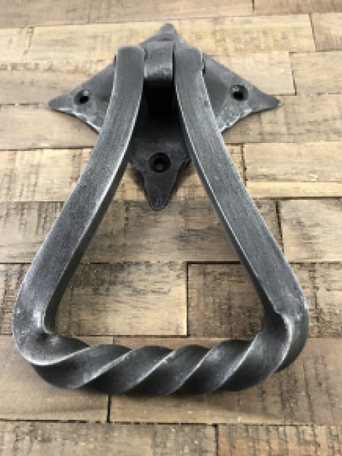 Door knocker wrought iron for on rustic wooden door, nice tough design.