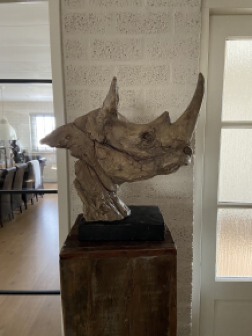 A beautiful head of a rhino, beautiful in detail, polystone wood look