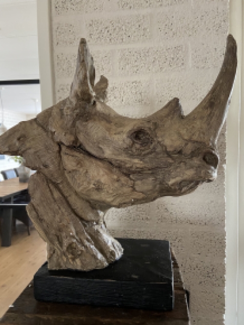 A beautiful head of a rhino, beautiful in detail, polystone wood look