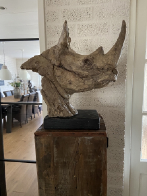 A beautiful head of a rhino, beautiful in detail, polystone wood look