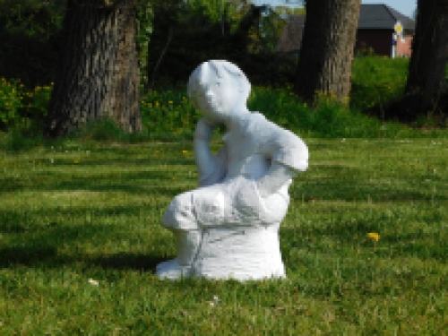 Statue sitting boy - solid stone