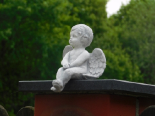 Angel - sitting - full made of stone