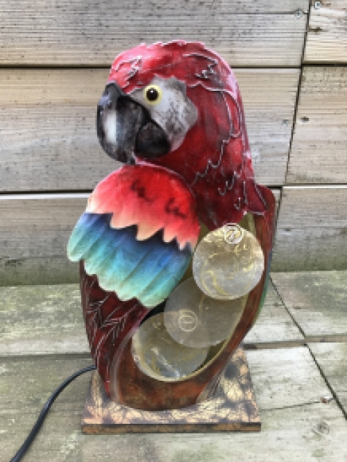 A metal lamp in the shape of a parrot, very beautiful!