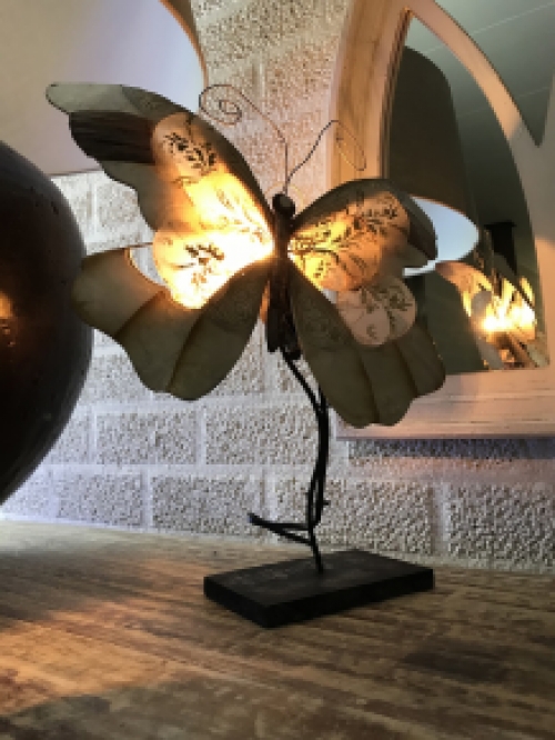 A metal lamp in the shape of a butterfly, very beautiful!