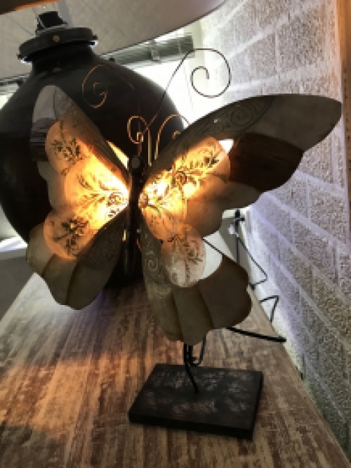 A metal lamp in the shape of a butterfly, very beautiful!