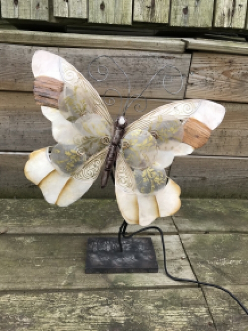 A metal lamp in the shape of a butterfly, very beautiful!