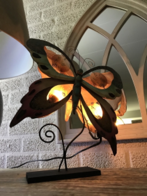 A metal lamp in the shape of a butterfly, very nice!