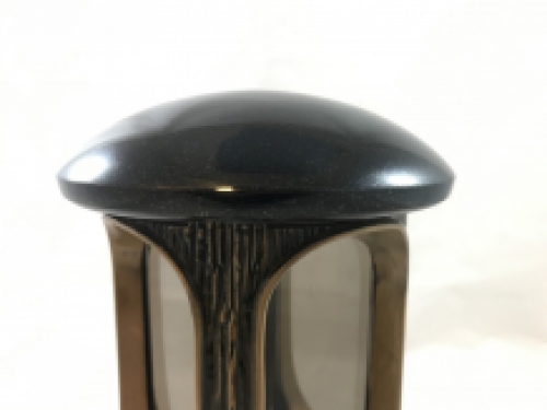 A lantern/grave lamp made entirely of granite with bronze fittings