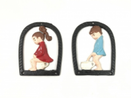 Set of toilet signs of a boy and a girl, metal in color