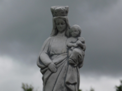 Mary with child in her arm, full of stone, untreated