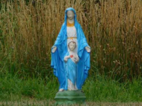 Mary with Jesus' sacred heart, full of stone church statue.