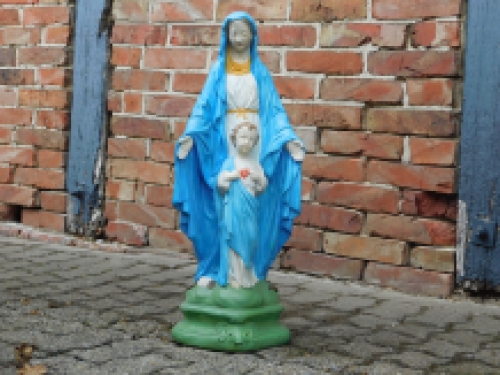 Mary with Jesus' sacred heart, full of stone church statue.