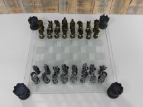 A chess game with the theme: ''knight-dragons'', beautiful chess pieces like medieval knights on glass chessboard with rooks.