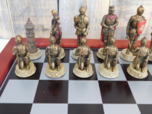 A chess game with the theme: ''MEDIEVAL KNIGHTS'', beautiful chess pieces as medieval knights