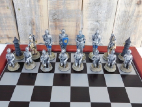 A chess game with the theme: ''MEDIEVAL KNIGHTS'', beautiful chess pieces as medieval knights
