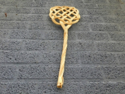 Old-fashioned carpet beater