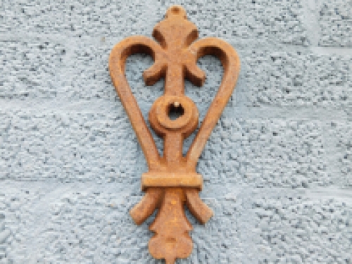 Wall anchor, cast iron, rust, heart shape.