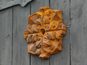 Cast-iron wall anchor in the shape of a leaf