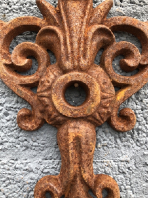 Wall anchor, cast iron, French lily shape.