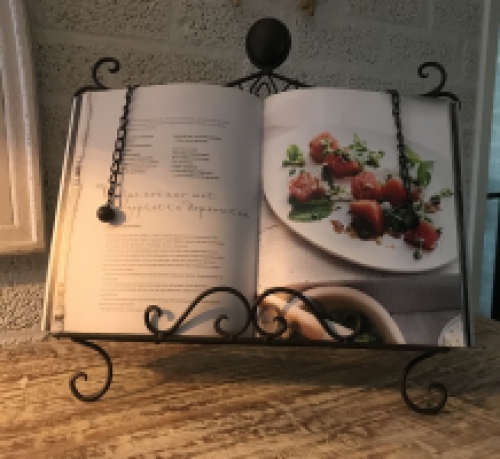 A stand / holder for pieces of music, menus, books, etc