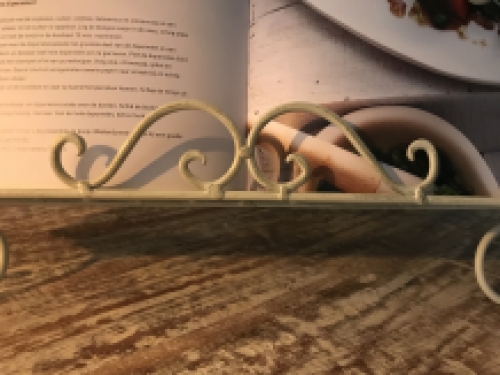 A white stand / holder for pieces of music, menus and, for example, books