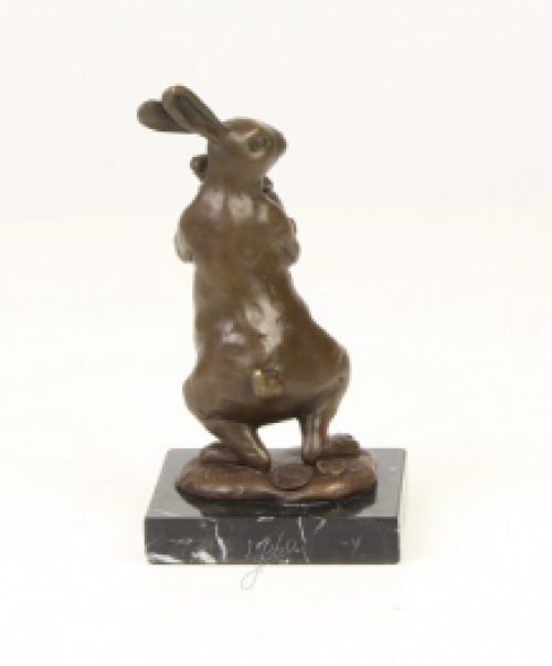 A bronze statue/sculpture of a rabbit with a cub