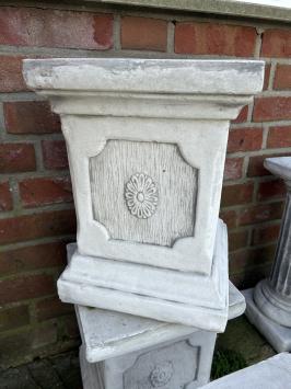 Pedestal pillar console made of solid cast stone.