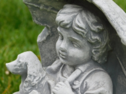 Statue child with dog - solid stone