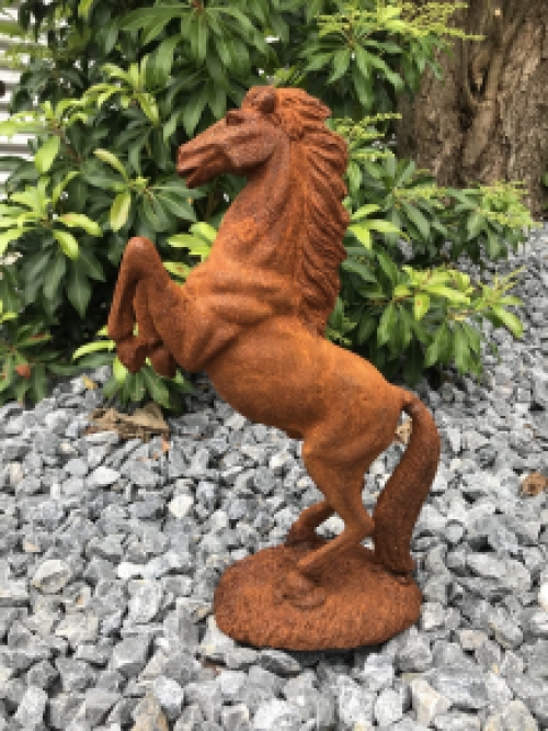 A beautiful statue of a rearing horse, cast iron rest