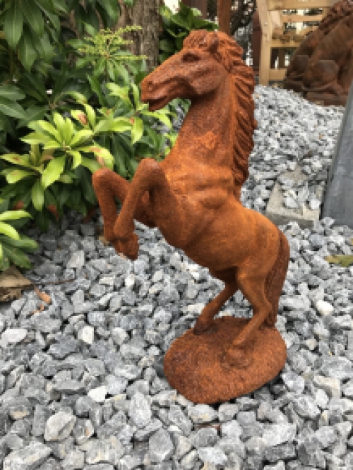 A beautiful statue of a rearing horse, cast iron rest