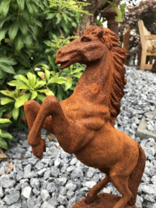 A beautiful statue of a rearing horse, cast iron rest