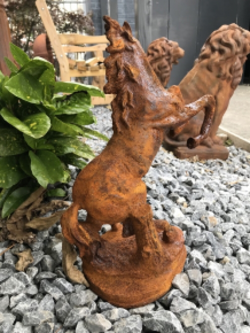 A beautiful statue of a rearing horse, cast iron rest