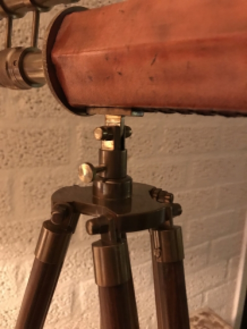 Beautiful decorative telescope on a wooden tripod