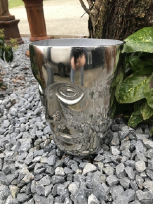 Beautiful aluminum vase, round in the shape of a face, nickel