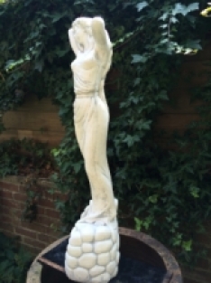 Beautiful statue of a lady, full of stone