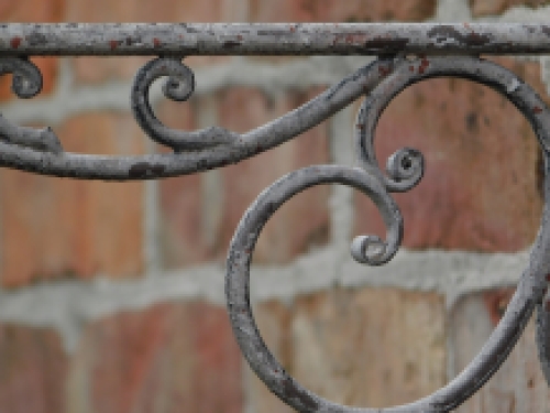 Ornate curved hanging basket wall hook - aged metal